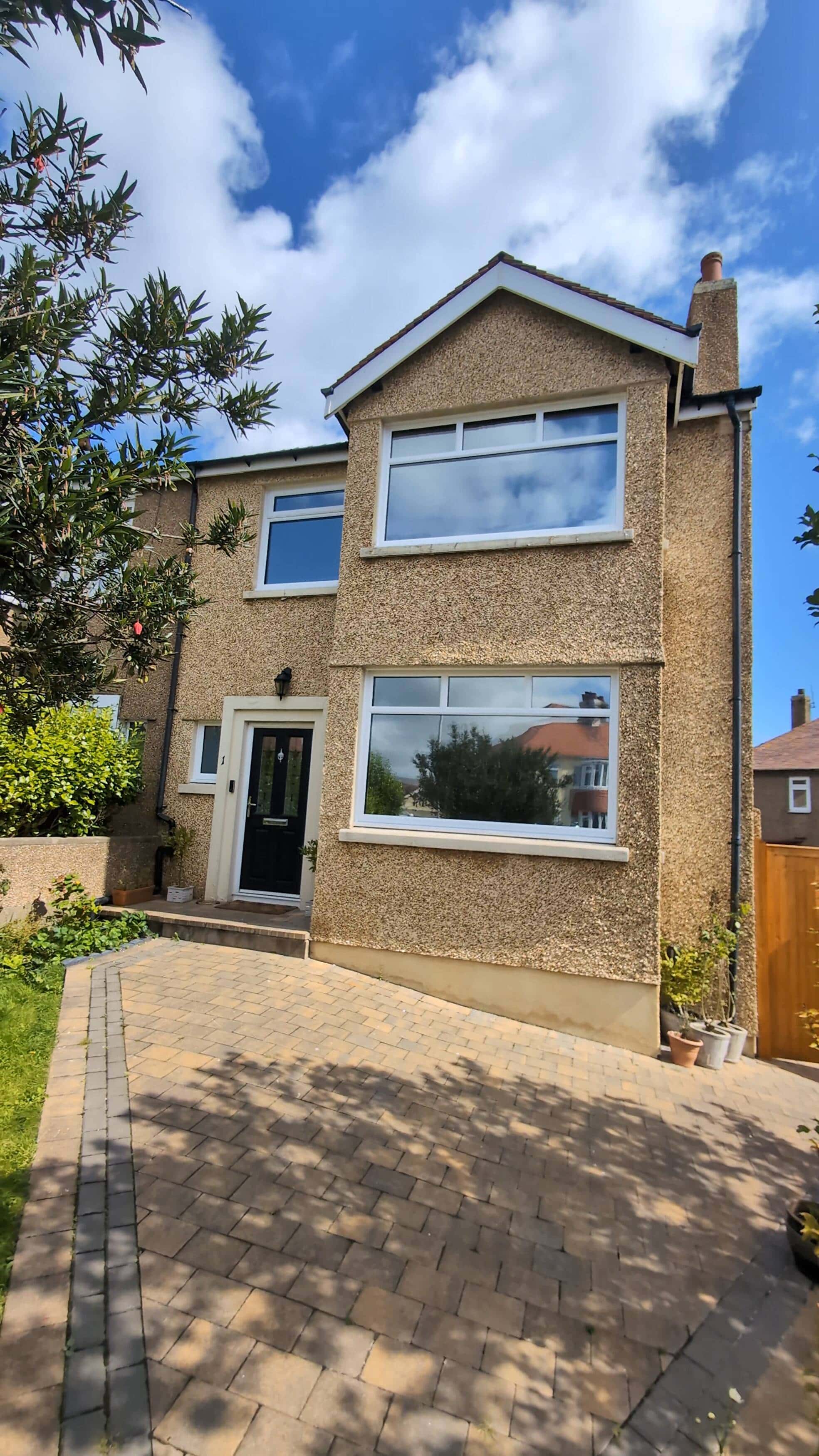 Lounge windows fitted with ManxTints privacy film in daylight